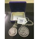 A nineteenth century silver coin mounted as a pendant on chain, together with another similar.