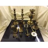 A tray of brass candlesticks, ship bookends, two brass anchors,