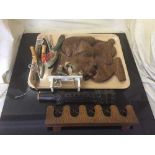 A tray of cast iron snooker cue holder, carved wooden instrument, wall plaques,