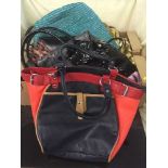 Three boxes of assorted lady's leather handbags