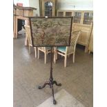 A Victorian tapestry pole screen