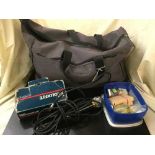 A Calvin Klein holdall of assorted cables, microphones, fuses,