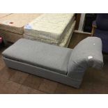 An upholstered storage chaise longue