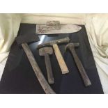 A large bundle of garden tools, hand tools,