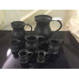 A Yates and Burch nineteenth century pewter tankard together with six others (7)