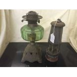 An early 20th century oil lamp and The Wolf safety miner's lamp