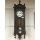 A late Victorian mahogany wall clock