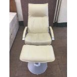 A cream relaxer armchair and stool