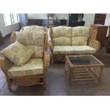 A four piece wicker conservatory suite