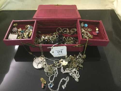 A concertina jewellery box containing various jewellery, black necklace, pendants, cufflinks,