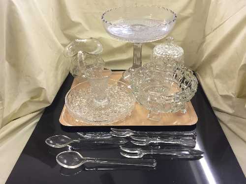 A tray of cut glass serving dishes with servers, comport,
