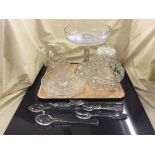 A tray of cut glass serving dishes with servers, comport,