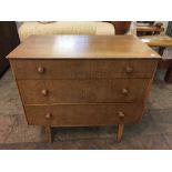 An oak three drawer chest and serving trolley