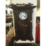 An early 20th century mahogany wall clock