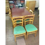 A mid 20th century formica topped kitchen table and six chairs