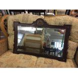 An Edwardian mahogany and gilt framed mirror