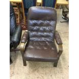 A late 20th century brown button leather armchair