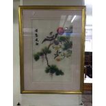 A gilt framed oriental silk work panel