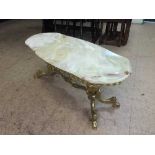 A shaped marble topped coffee table on gilt metal base
