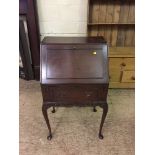 A mahogany lady's bureau on cabriole legs