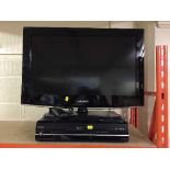 A Samsung 26 inch LCD TV with remote and a Toshiba DVD TV recorder with remote