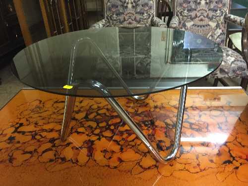 A 1970's circular smoked glass coffee table on chrome base