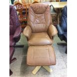 A brown leather swivel armchair with stool