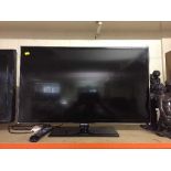 A Samsung 32 inch LCD TV with remote