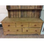 A low pine five drawer chest