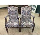 A pair of mahogany upholstered armchairs