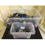 A plastic crate of assorted Lego and other building blocks