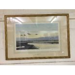 A gilt framed and signed Peter Scott print - High tide and wild swans