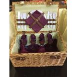 A wicker picnic basket, quantity of holdalls,