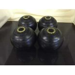 A box of five sets of bowling bowls