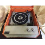 A Tellux 1950's table top record player and an electric sewing machine