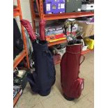 Three golf bags of assorted clubs and a folding golf trolley