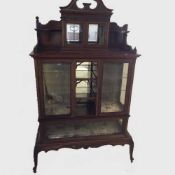 A Victorian mahogany display cabinet, compartmentalised and lined in green velvet, width 104 cm.