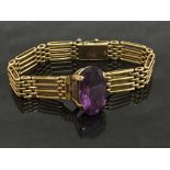 A 15ct gold gate bracelet set with an amethyst, 27.3g.