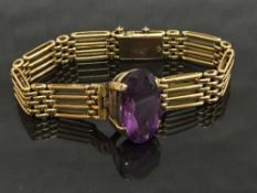 A 15ct gold gate bracelet set with an amethyst, 27.3g.