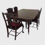 A Georgian mahogany extending D-end dining table, with three leaves, length extended 265 cm,