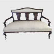 A Victorian inlaid rosewood salon settee upholstered in cream silk, width 136 cm.