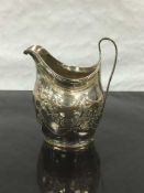 A George III silver milk jug, William Hall, London 1799, height 10.5cm, 91.7g.