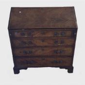 A George III mahogany bureau, on bracket feet with brass swan necked handles, width 100 cm.