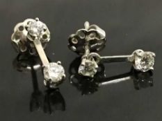 A pair of 18ct white gold diamond drop-stud earrings.