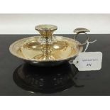 A silver Lindisfarne pattern candlestick holder with snuffer, Reid & Sons Ltd, Bimingham 1990,