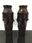 A pair of late nineteenth/early twentieth century Japanese bronze vases,