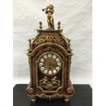 A nineteenth century style Boulle effect mantel clock, with key.