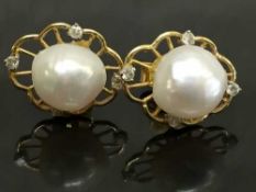 A pair of continental gold blister pearl and diamond earrings.
