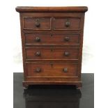 A late Victorian miniature chest of drawers, an apprentice piece,