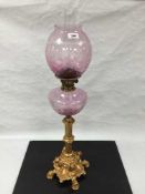 An ornate gilt metal and etched glass oil lamp, height 82cm.